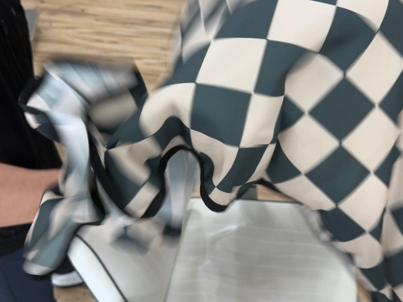 Close detail of a barber cape in motion